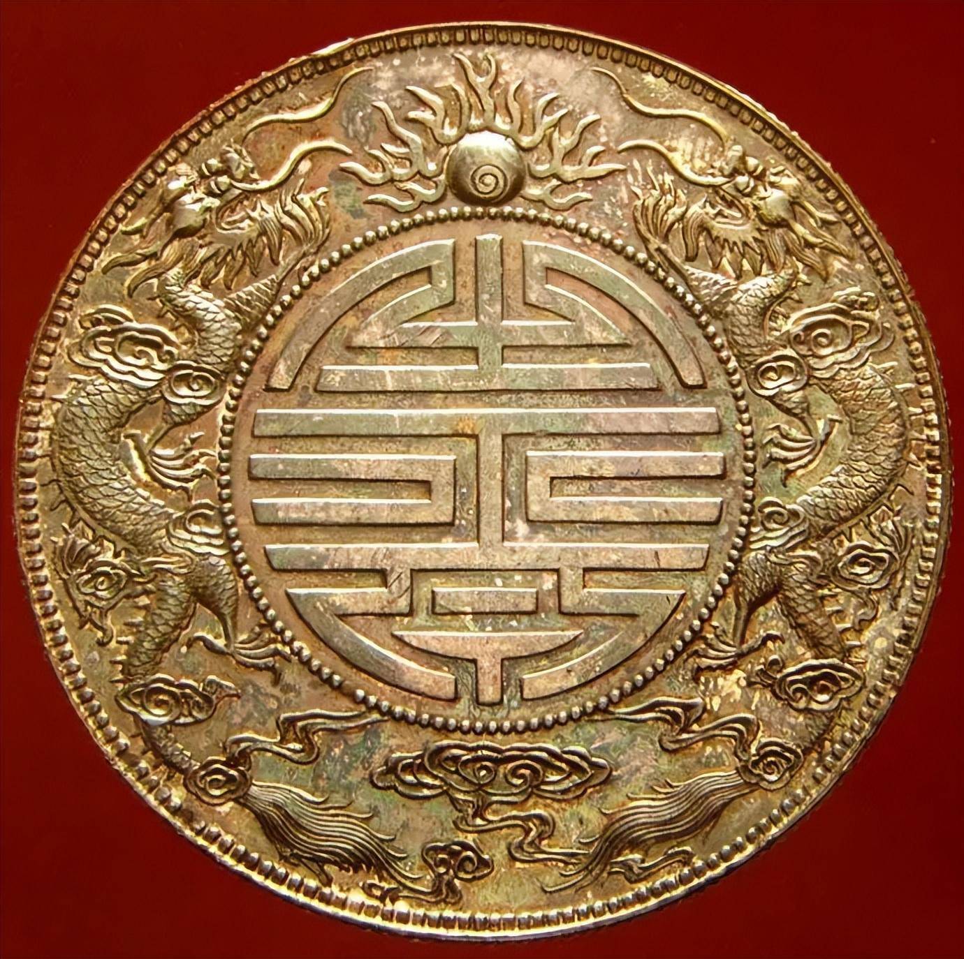 你手中的广东省造双龙寿字币<strong></p>
<p>上交易所的币是真币吗</strong>，是真的吗？